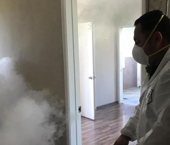 SERVPRO of Westminster worker in white suit with fogging machine 