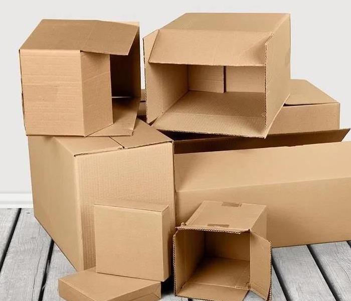 Piles of cardboard boxes in room 