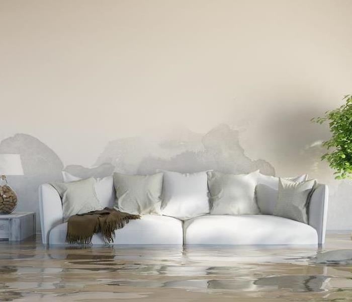 water flooding in a room with couch 